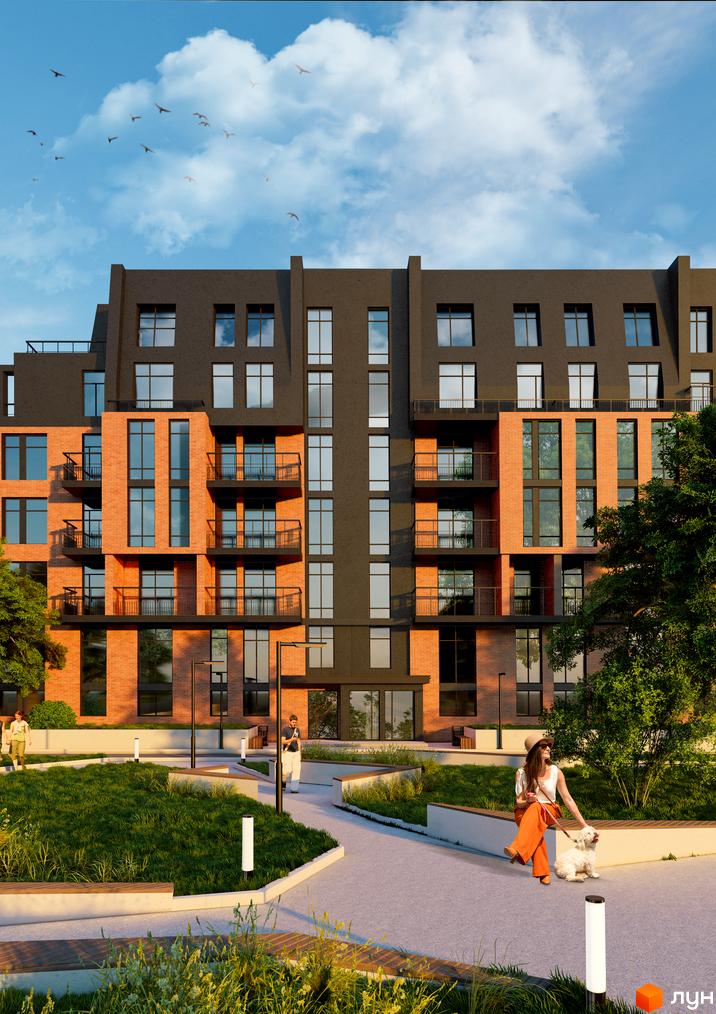 Висотна будівля ЖК Гринвіч Парк з цегляним фасадом та великими вікнами. На прибудинковій території доглянутий газон, доріжки та лавки для відпочинку.