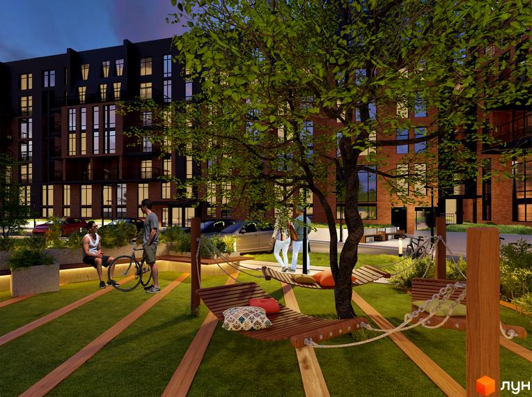 Зображення житлового комплексу Гринвіч Парк з темно-коричневими фасадами та великими вікнами. На території комплексу розташовані зони відпочинку з гамаками та зелені насадження.