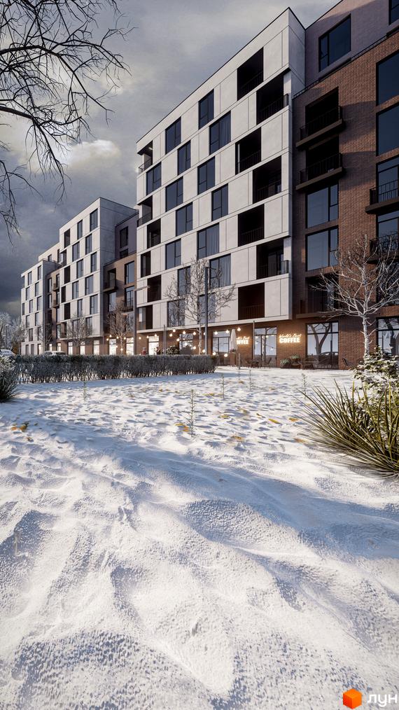 Зовнішній вигляд житлового комплексу Panorama з білими та цегляними фасадами, балконами та великими вікнами, на тлі зимового пейзажу зі снігом та деревами.