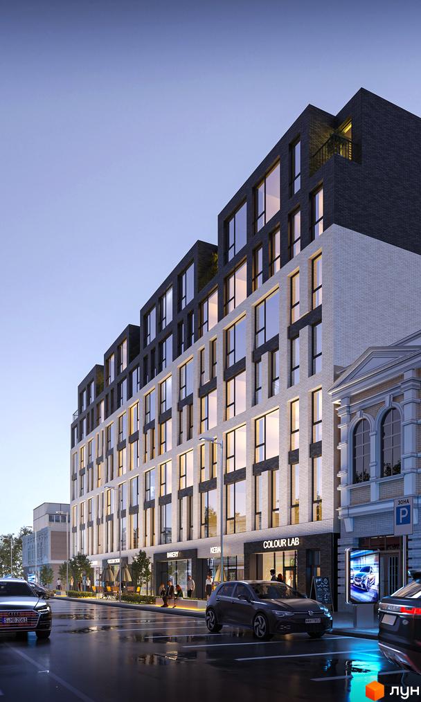 Новобудова Shevchenka 58a з білою та темно-сірою цегляною обробкою, великими вікнами та комерційними приміщеннями на першому поверсі, розташована на мокрій вулиці з припаркованими автомобілями.