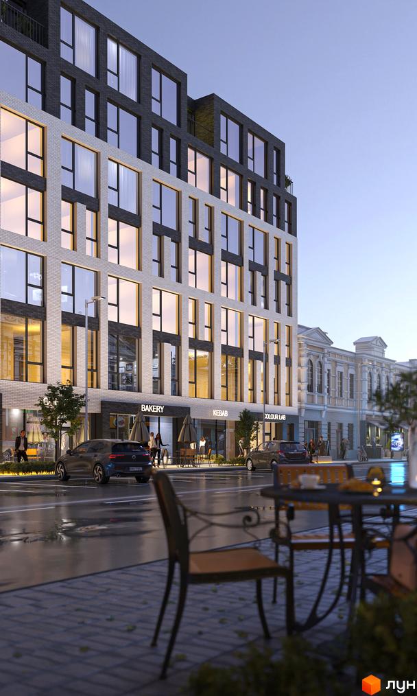 БФК Shevchenka 58a - це сучасна новобудова з цегляним фасадом та великими вікнами. Перед будинком розташована доглянута прибудинкова територія з вуличними меблями та деревами.