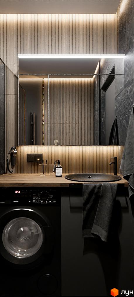 Інтер'єр ванної кімнати з пральною машиною, раковиною та великим дзеркалом з підсвічуванням. Дизайн у темних тонах з дерев'яними панелями.