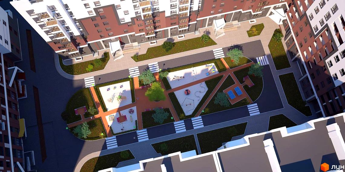 Вид зверху на житловий комплекс Олімп з дитячими майданчиками та зонами відпочинку. Сучасна архітектура будівель та упорядкована прибудинкова територія.