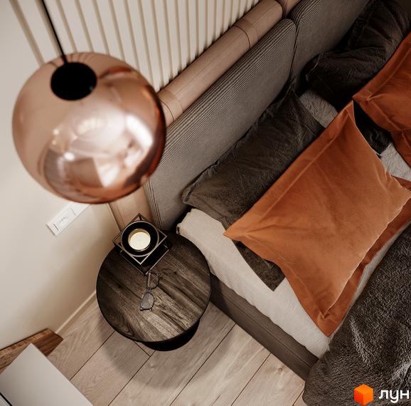 Інтер'єр спальні з м'яким узголів'ям та приліжковою тумбою в ЖК SOLOWAY. Затишна атмосфера з акцентами на деталі.