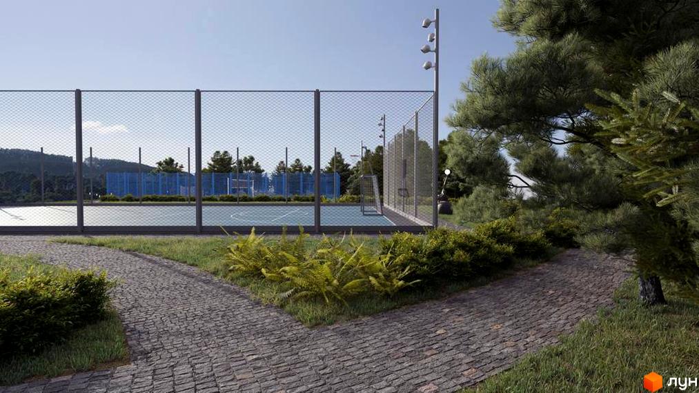 Котеджне містечко КМ Riviera City Park: спортивний майданчик з покриттям та огорожею, оточений зеленню та доріжками з бруківки.