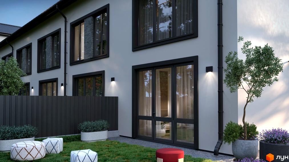 Зовнішній вигляд будинку по вул. Ярославська, 26в. На прибудинковій території розташовані зелені насадження та місця для відпочинку.