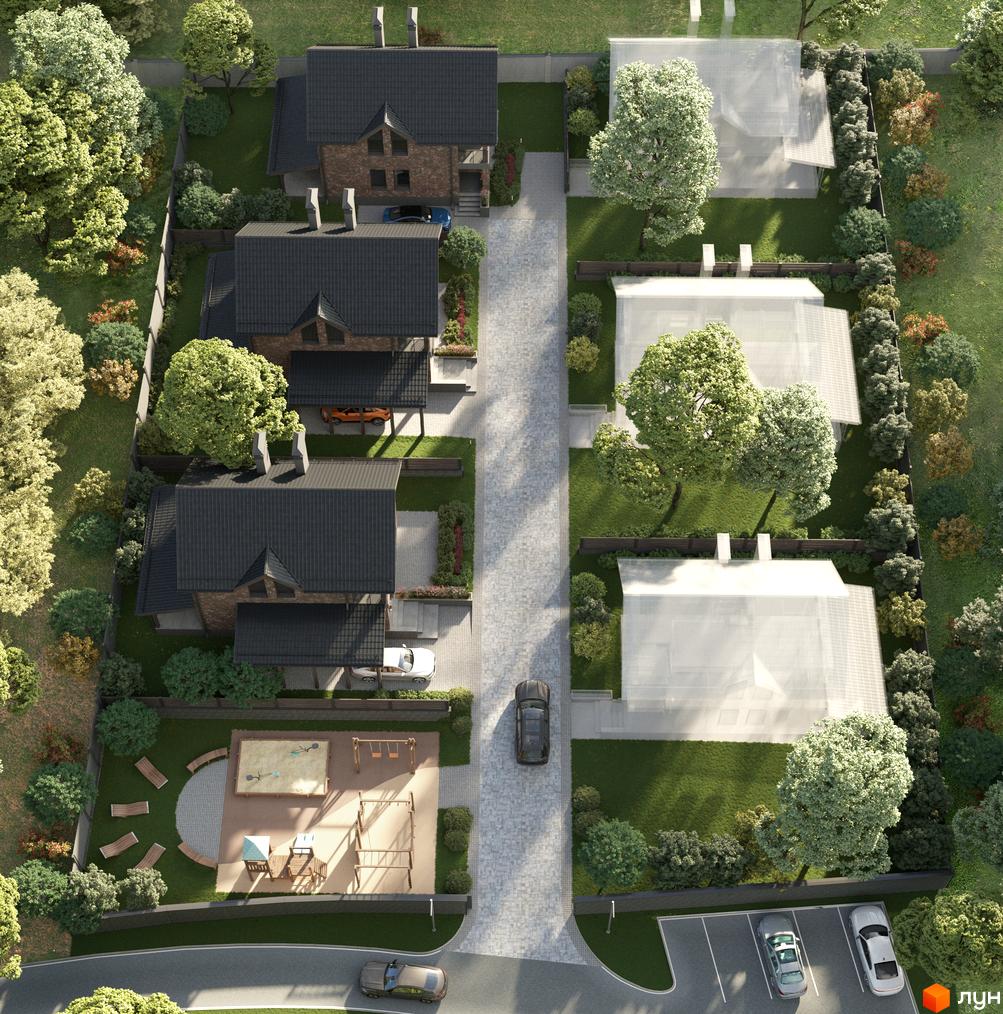 Вигляд зверху на Котеджне містечко Lake View з будинками з темними дахами та великою територією з деревами, газонами та дитячим майданчиком.