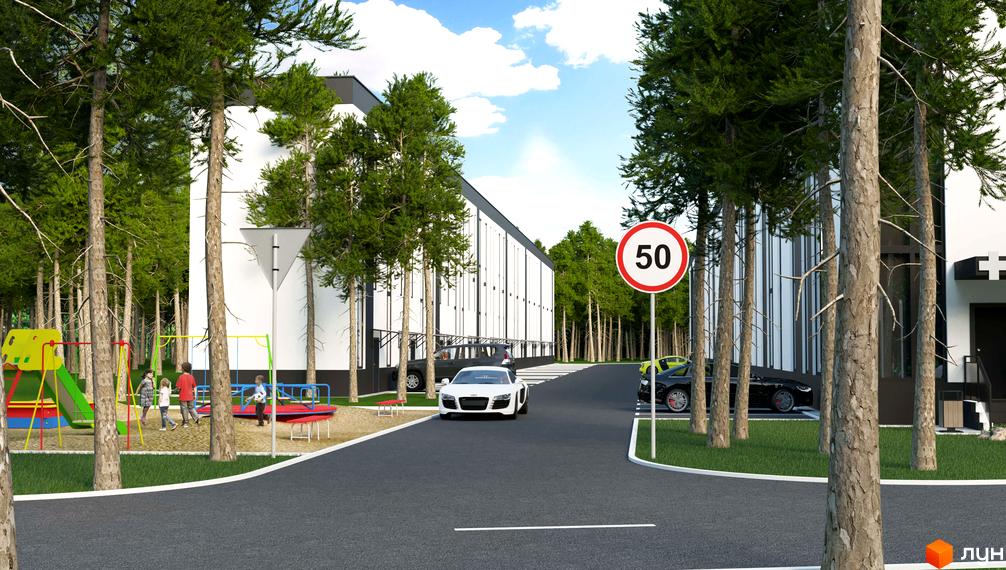 Зображення фасаду Aura Park та прибудинкової території з дитячим майданчиком. Вигляд на дорогу з автомобілями та знаком обмеження швидкості.