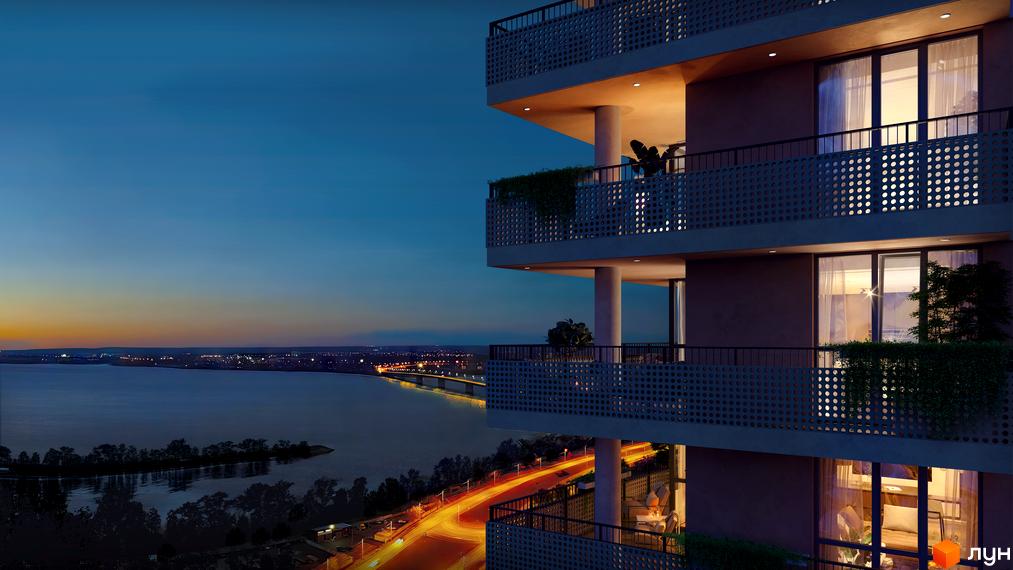 Зображення Житлового комплексу PEYOT з балконами, з яких відкривається вид на річку та нічне місто.