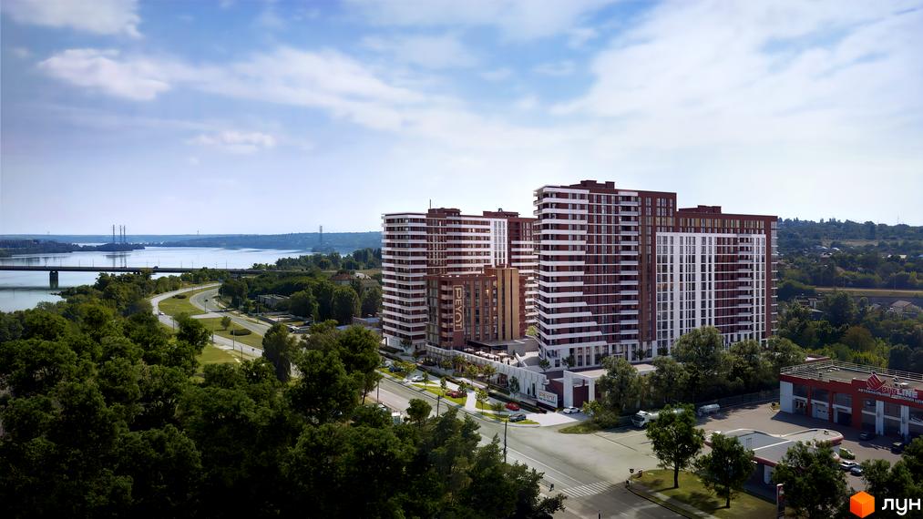 Високі будинки ЖК PEYOT з білими та коричневими фасадами розташовані біля дороги та річки. На території комплексу є парковка та зелені насадження.