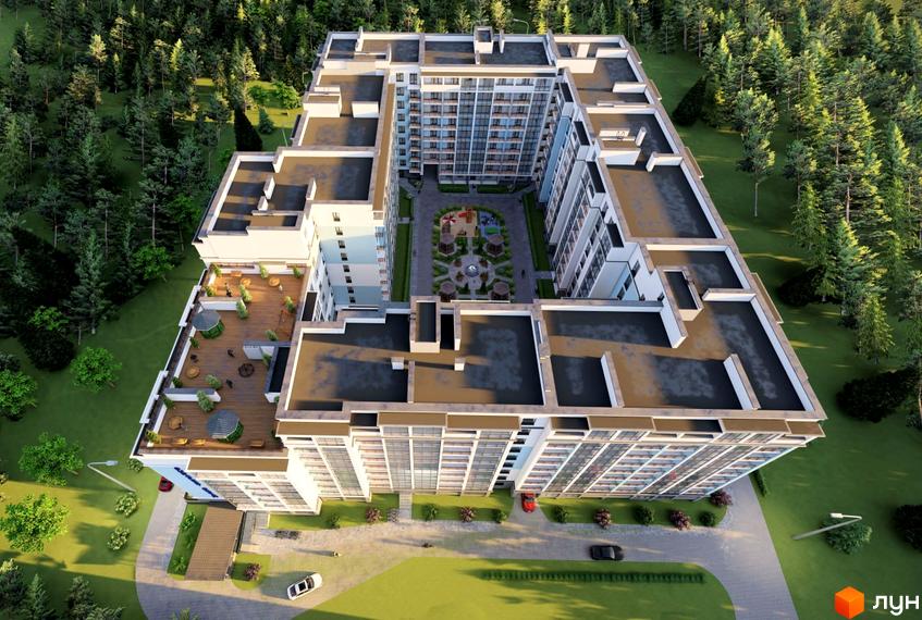 Вид зверху на Житловий комплекс Budapest Dream. Багатоповерховий будинок з терасами та внутрішнім двором з дитячим майданчиком, навколо зелені дерева.