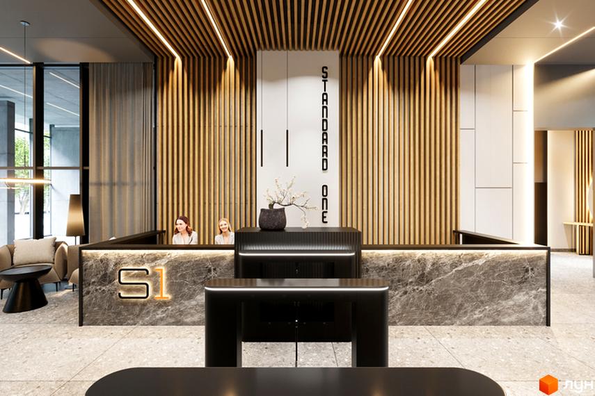 Інтер'єр холу Житлового комплексу Standard One Obolon з ресепшеном та зоною очікування. Оздоблення деревом та мармуром.