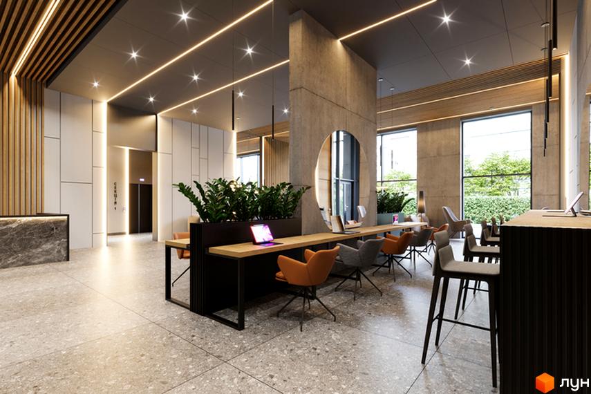 Інтер'єр лобі Новобудови Standard One Obolon з зоною відпочинку та великими вікнами. Стіни оздоблені бетоном та деревом.