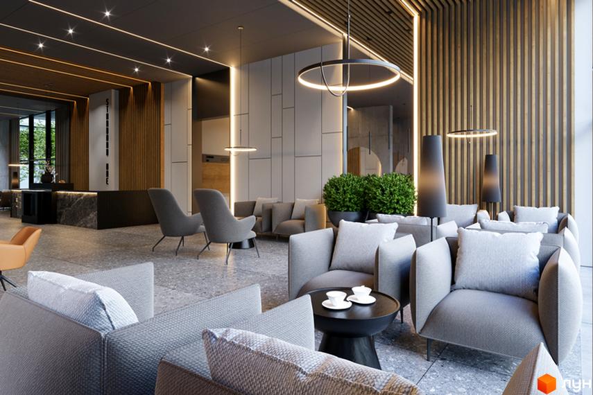 Інтер'єр лобі Житлового комплексу Standard One Obolon з м'якими меблями та декоративним освітленням.