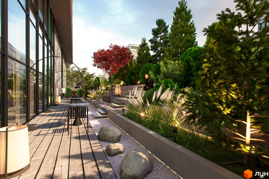 Зображення тераси з лаунж зоною в Житловому комплексі Standard One Obolon. Навколо багато зелених насаджень.