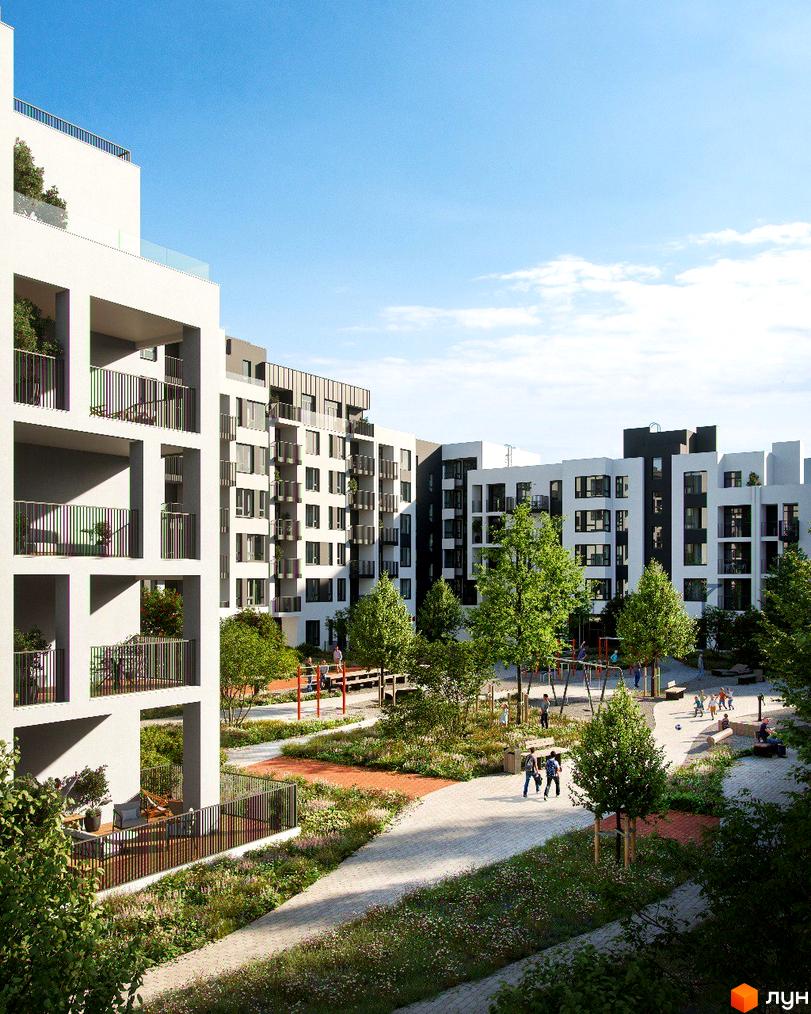 Житловий комплекс Empatika з білими фасадами та балконами, зеленою прибудинковою територією та дитячим майданчиком.