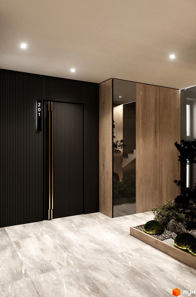 Сучасний вхід у житловий комплекс Grand Hills з дверима та номером 201, оздоблений дерев'яними панелями та дзеркалами. Біля входу розташована мініатюрна зелена зона з рослинами та каменями.