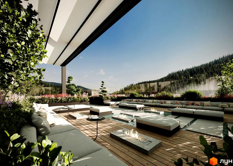 Апарт-комплекс GLACIER з відпочинковою зоною на терасі з камінами та меблями, що виходить на гірський пейзаж.