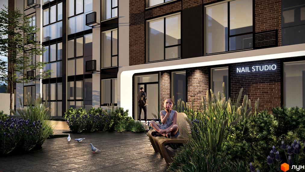 Житловий комплекс Онікс: фасад будівлі з великими вікнами та цегляною кладкою, дитина сидить на лавці біля входу в 