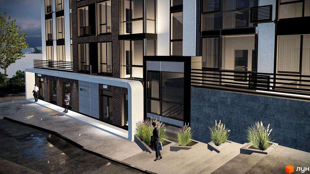 Фасад житлового комплексу ЖК Онікс з входами та вікнами. Територія перед будинком з доріжками та рослинами.