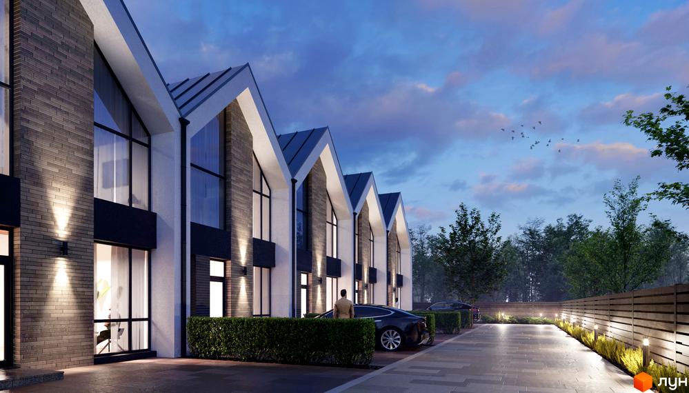 Таунхауси FreeDOM's з цегляним фасадом та великими вікнами. Прибудинкова територія з доглянутими кущами та освітленням.