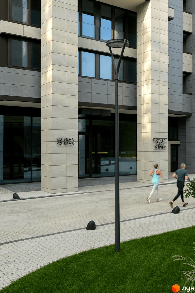 Зовнішній вигляд новобудови Crystal Park Tower з сірою плиткою та великими вікнами. На прибудинковій території розташовані зелені насадження та доріжки для прогулянок.