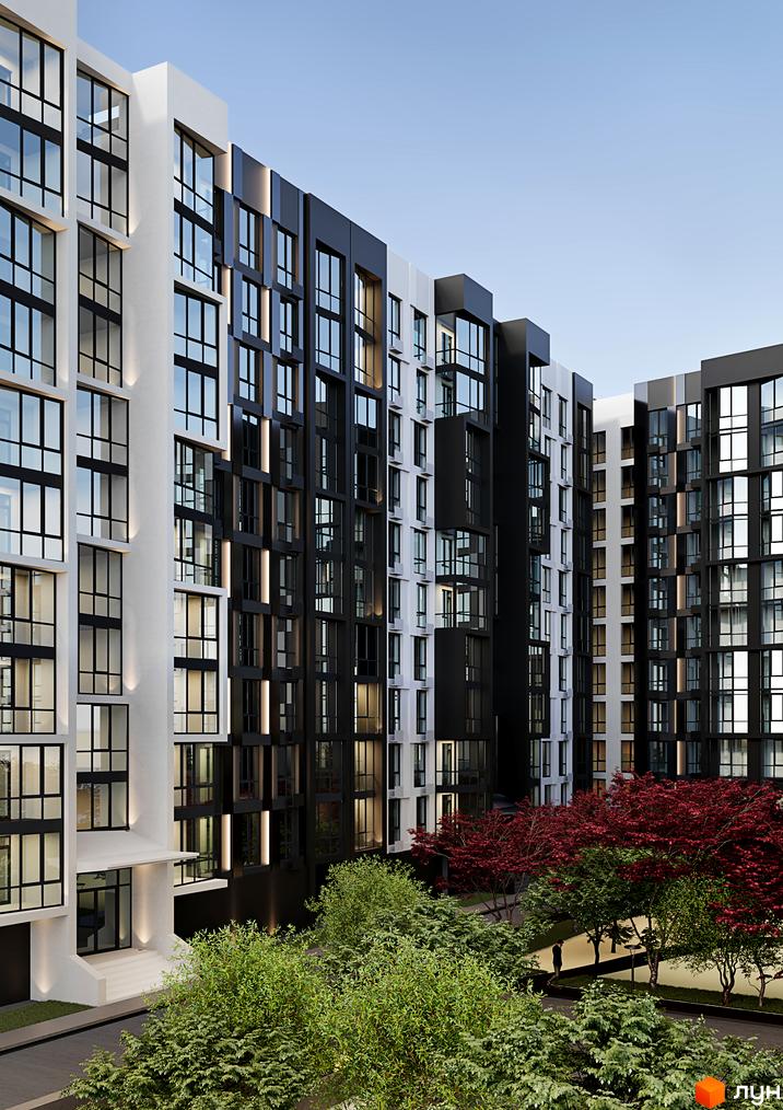 Зовнішній вигляд житлового комплексу Аристократ з білими та чорними фасадами, великими вікнами та затишною прибудинковою територією з деревами.