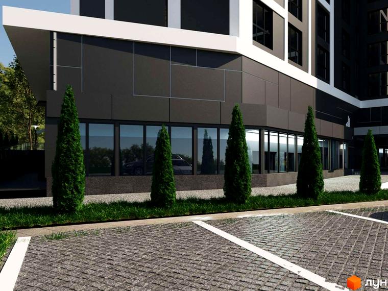 Зовнішній вигляд новобудови ЖК PANORAMA DE LUXE з панорамними вікнами та акуратним паркінгом. Зелені туї вздовж фасаду створюють затишну атмосферу.