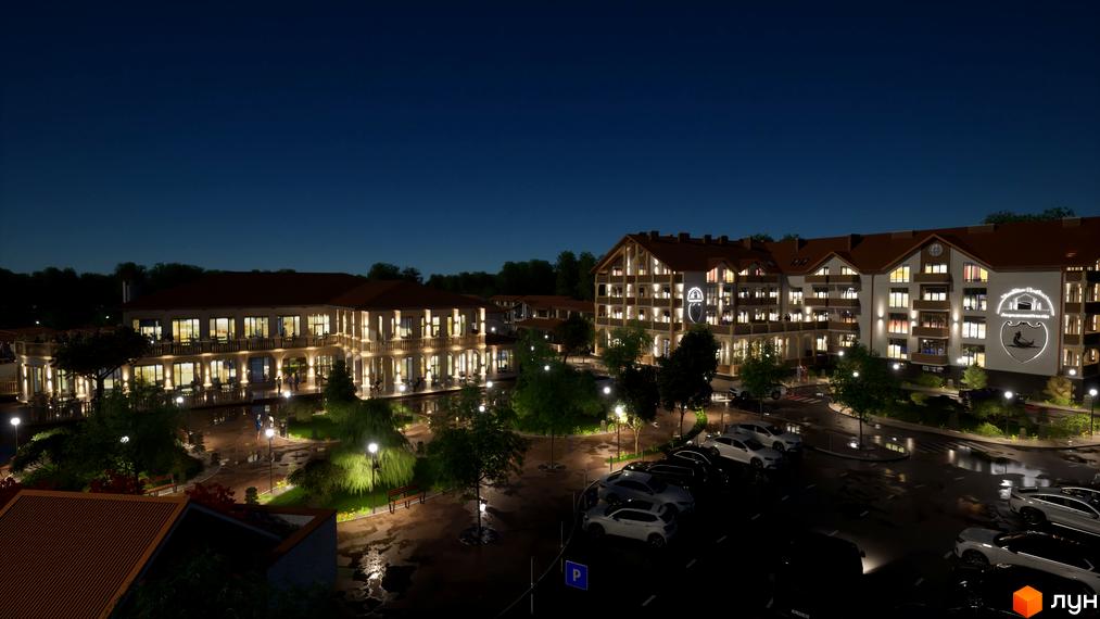 Апарт-комплекс Little Italy Apartments вночі з підсвіченими фасадами та паркінгом. Навколо комплексу розташовані дерева та освітлені пішохідні доріжки.