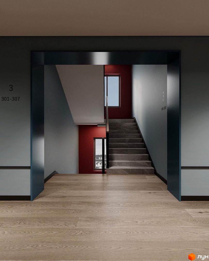 Сходи в ЖК Молодість з червоними стінами та вікнами з видом на місто. Сучасний дизайн сходової клітки.