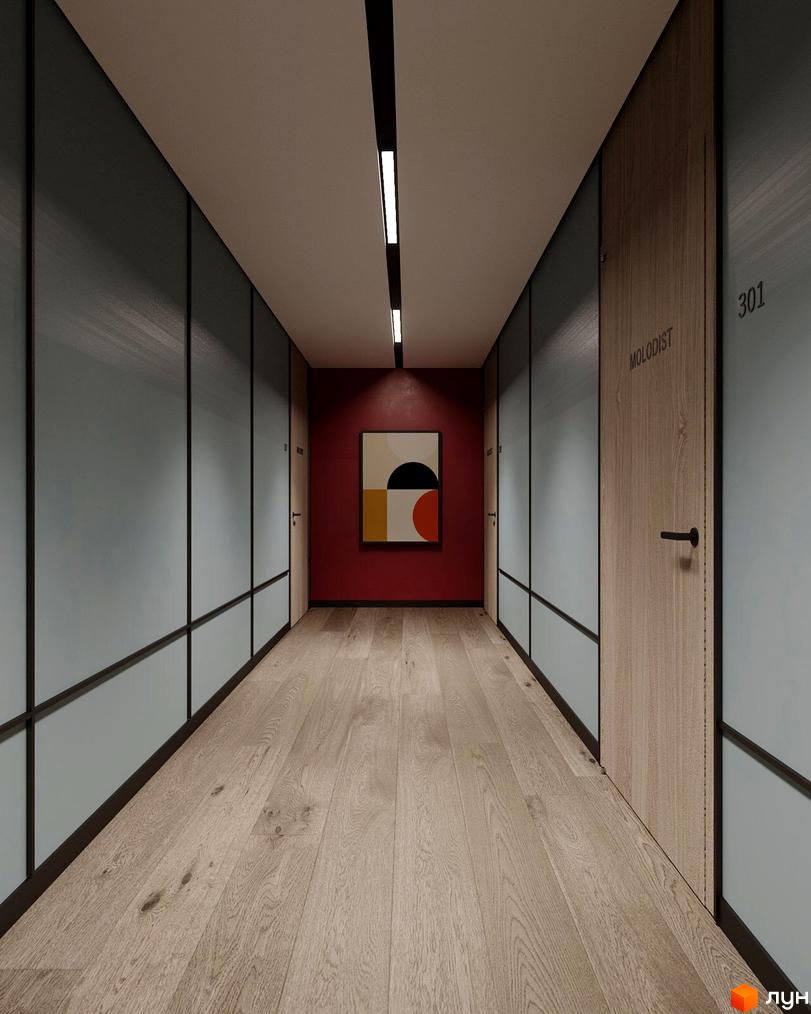 Сучасний коридор житлового комплексу Молодість з дерев'яними дверима та абстрактною картиною на червоній стіні.