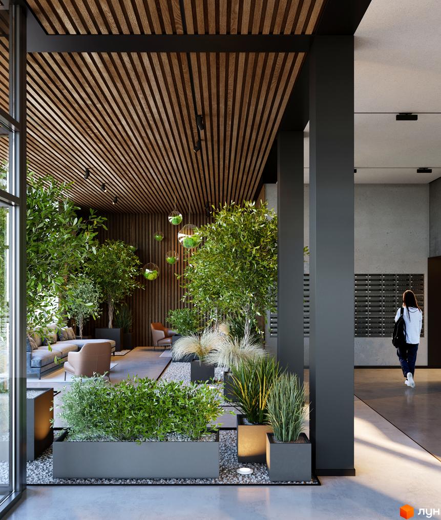 Холл житлового комплексу BORGO VERDE з рослинами та місцями для відпочинку. Вхідна група з поштовими скриньками та виходом на вулицю.