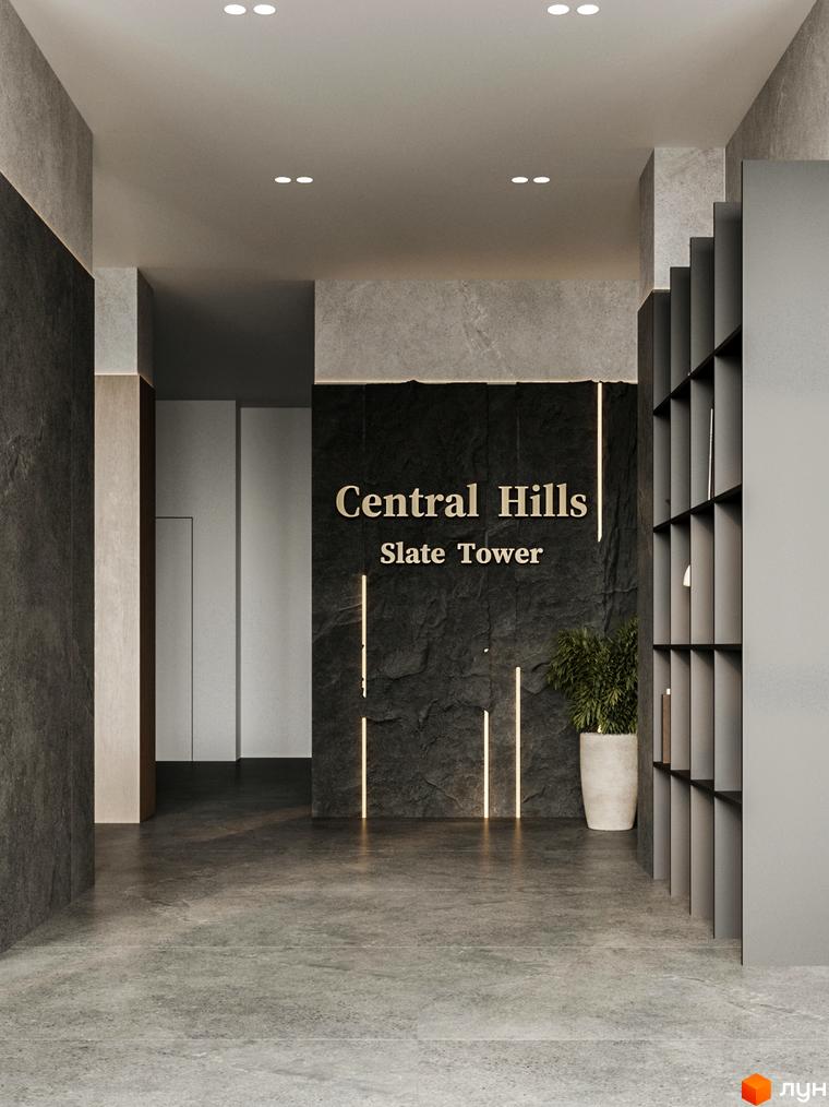Сучасний вхід у житловий комплекс Central Hills, оформлений у стилі лофт з кам'яною облицовкою та підсвіткою.