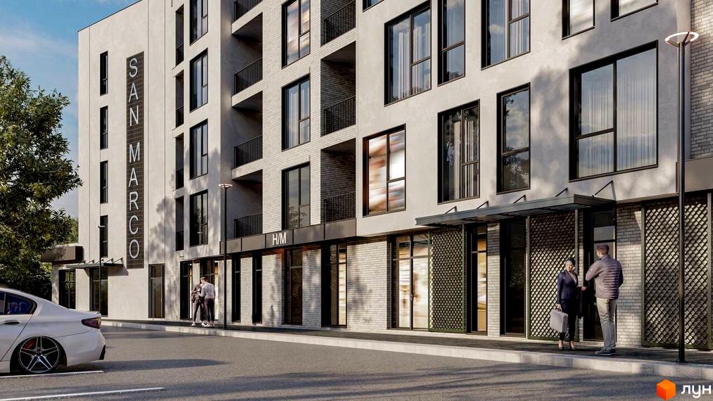 Зовнішній вигляд будівлі житлового комплексу San Marco з великими вікнами та балконами. На передньому плані асфальтована дорога та припаркований автомобіль.