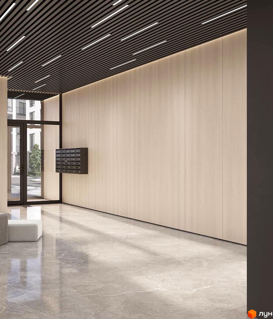 Інтер'єр холу в ЖК Клубний будинок San Marco з дерев'яними панелями на стінах та мармуровою підлогою. На стіні розташовані поштові скриньки.