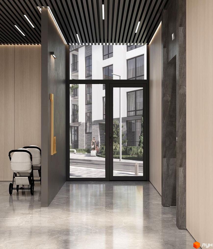 Вхідна група житлового комплексу San Marco з великими вікнами та скляними дверима, світлою підлогою та оздобленням стін деревом.