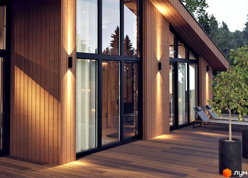 Котеджне містечко КМ Greenhill chalet з дерев'яним фасадом та великими вікнами, терасою та зоною відпочинку.