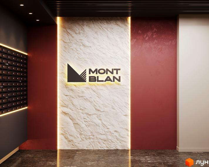 Вхідна група житлового комплексу Mont Blanc з дизайнерським оздобленням стін та підсвічуванням. На стіні розміщено логотип комплексу.