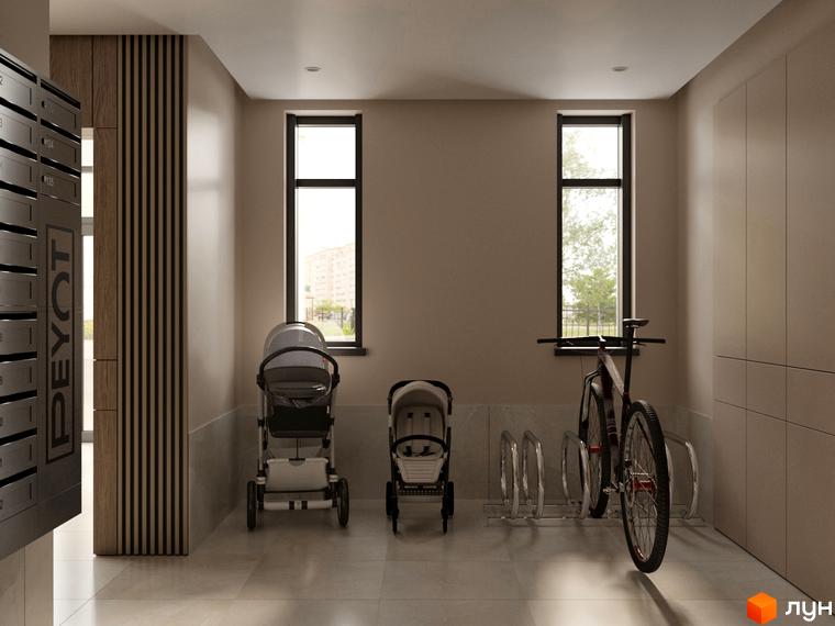 Інтер'єр вхідної групи Житлового комплексу PEYOT з дитячими візочками та велосипедом. У приміщенні є поштові скриньки та великі вікна.