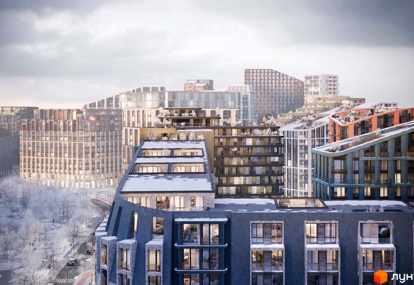 Житловий комплекс LUCKY LAND з різноповерховими будинками та дахами, вкритими снігом. Навколо засніжені дерева та дорога.