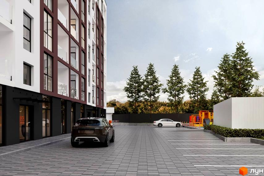 Фасад Житлового комплексу Набережний квартал з білими стінами та темними елементами. На прибудинковій території облаштований паркінг та дитячий майданчик.