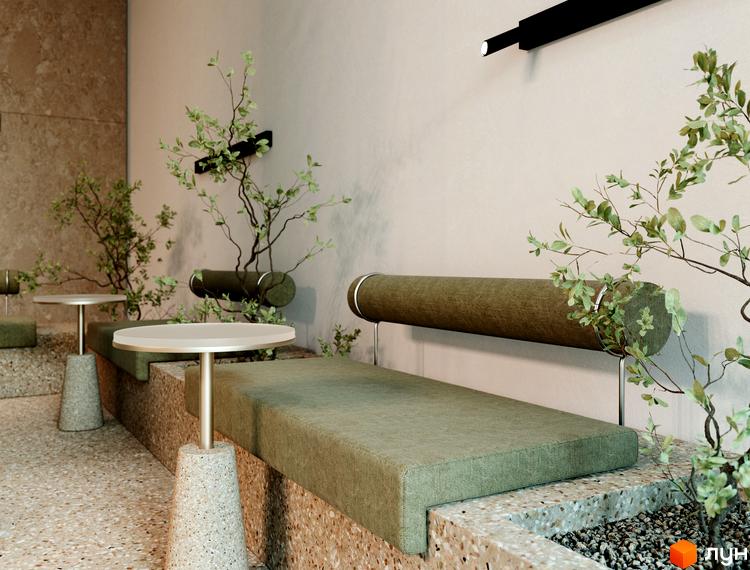 Затишна зона відпочинку в ЖК TRIVIUM з м'якими диванами, столиками та рослинами, що створюють атмосферу спокою та комфорту.