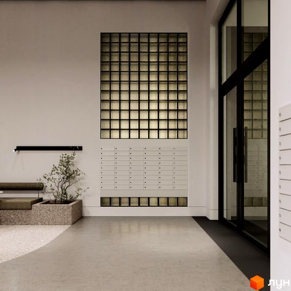 Вхідна група в ЖК TRIVIUM з скляними блоками, поштовими скриньками та скляними дверима. Бетонна підлога та рослини додають простору затишку.