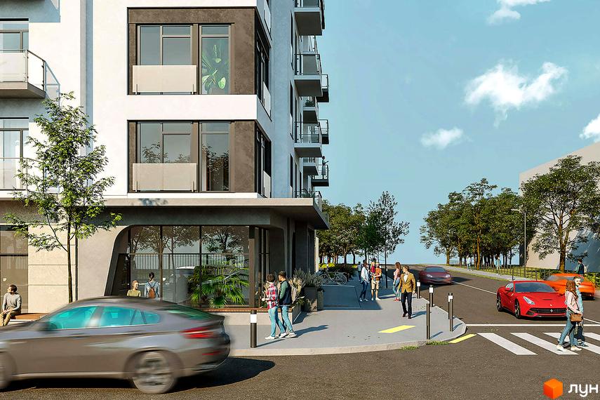 Зовнішній вигляд житлового комплексу Новий Звягель з фасадами білого та сірого кольорів, балконами та великими вікнами. Прибудинкова територія з деревами, тротуаром, дорогою та людьми.