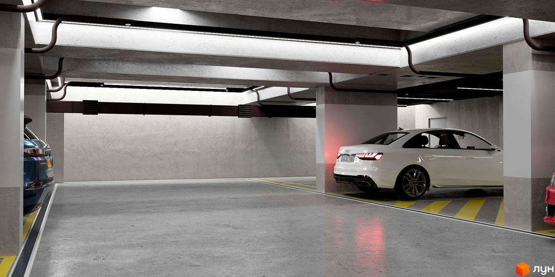 Сучасний паркінг житлового комплексу Новий Звягель з автомобілями та бетонними колонами. Навколо добре освітлена територія.