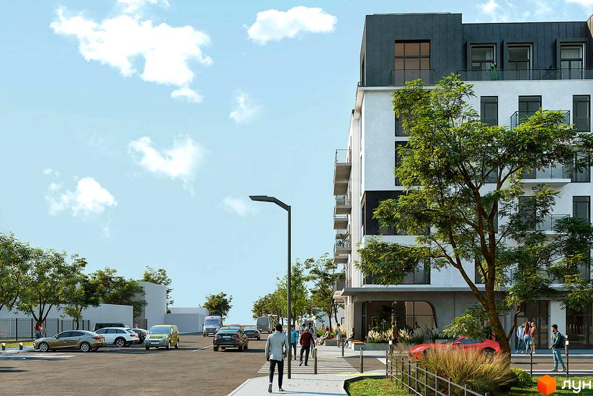 Житловий комплекс Новий Звягель: сучасна архітектура фасаду та доглянута прибудинкова територія з парковкою та зеленими насадженнями.