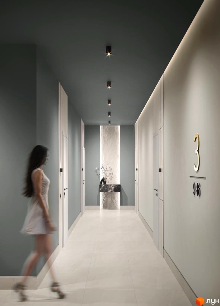 Сучасний коридор житлового комплексу N69 Residents з дверима та декоративною стіною. Дизайн інтер'єру новобудови.