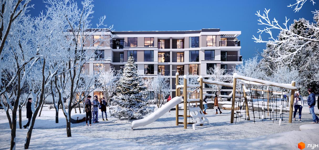 Житловий комплекс Варшавський deluxe взимку з дитячим майданчиком та ялинкою. Сучасна архітектура будинку з балконами та великими вікнами.