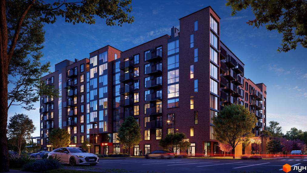 Житловий комплекс Royal Town з цегляним фасадом та великими вікнами, з балконами та освітленою прибудинковою територією ввечері.