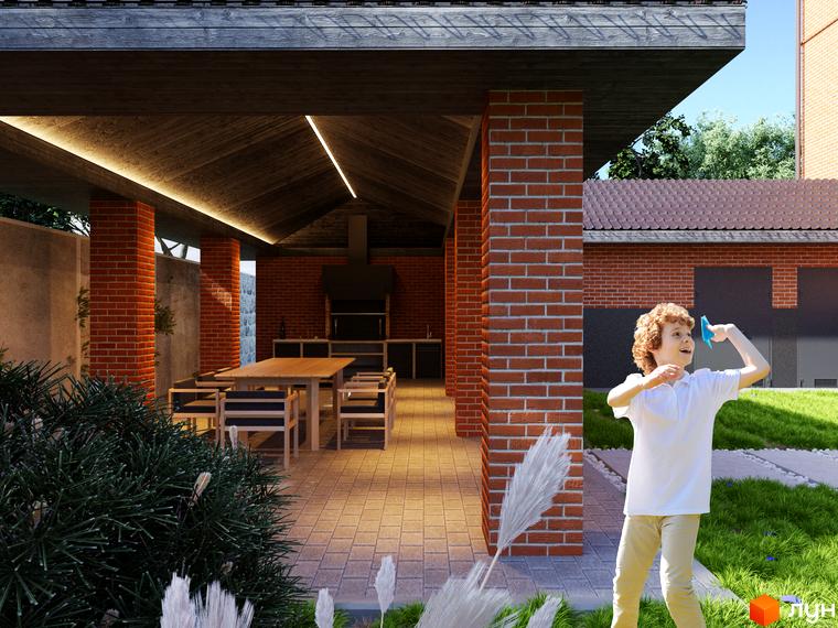 Клубний будинок „Проців-1 (Лазурний)“ з цегляним фасадом та відкритою терасою. Поруч зелена галявина з дитиною, що грається.